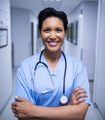 portrait-of-female-nurse-standing-in-corridor-2023-11-27-04-56-57-43KSRUB