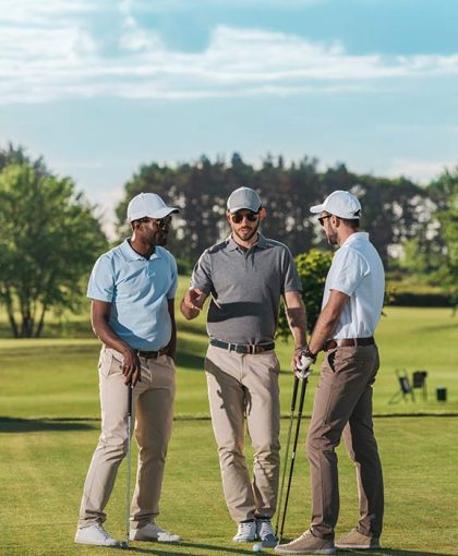 multiethnic-group-of-golfers-holding-clubs-and-tal-2024-11-17-12-16-52-RJF44HK