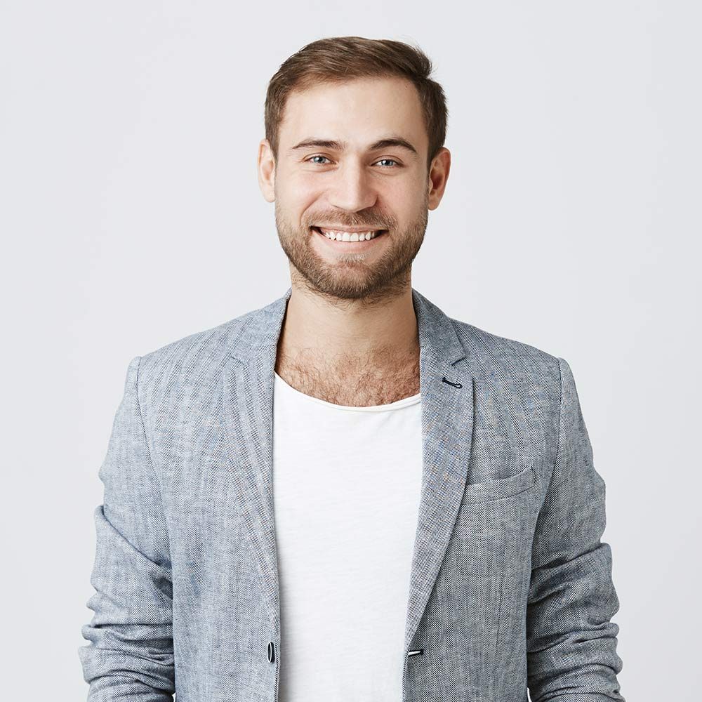 smiling-man-in-jacket-posing-indoors-2026-01-05-05-14-15-utc