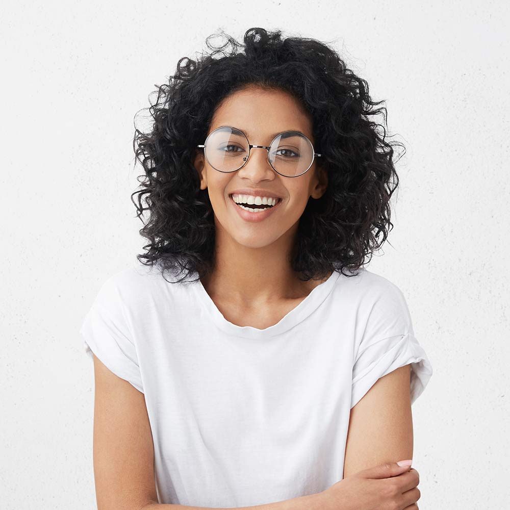 smiling-woman-wearing-glasses-and-white-t-shirt-2026-01-07-01-11-12-utc