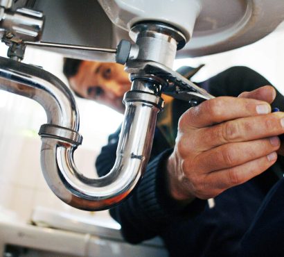 close-up-of-plumber-repairing-sink-with-tool-in-ba-2025-02-04-02-12-53-9XBKELG