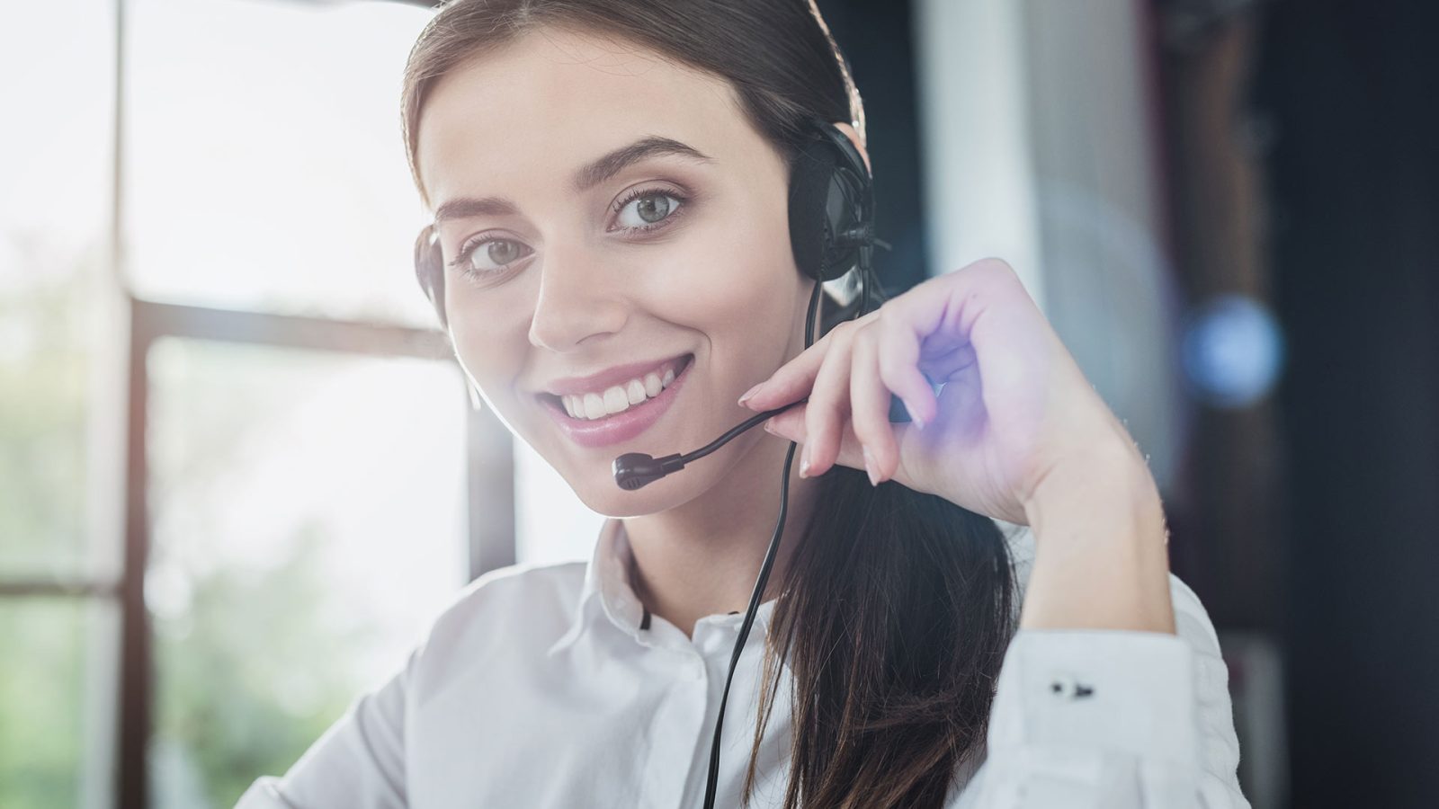 beautiful-female-call-center-worker-with-headphone-2023-11-27-05-21-47-FDF6X5G
